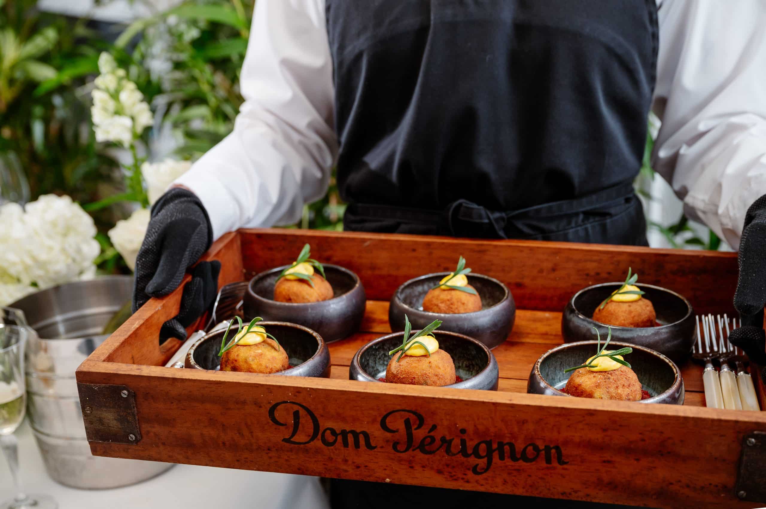 Corporate catering styles. Bowl food being served from a tray