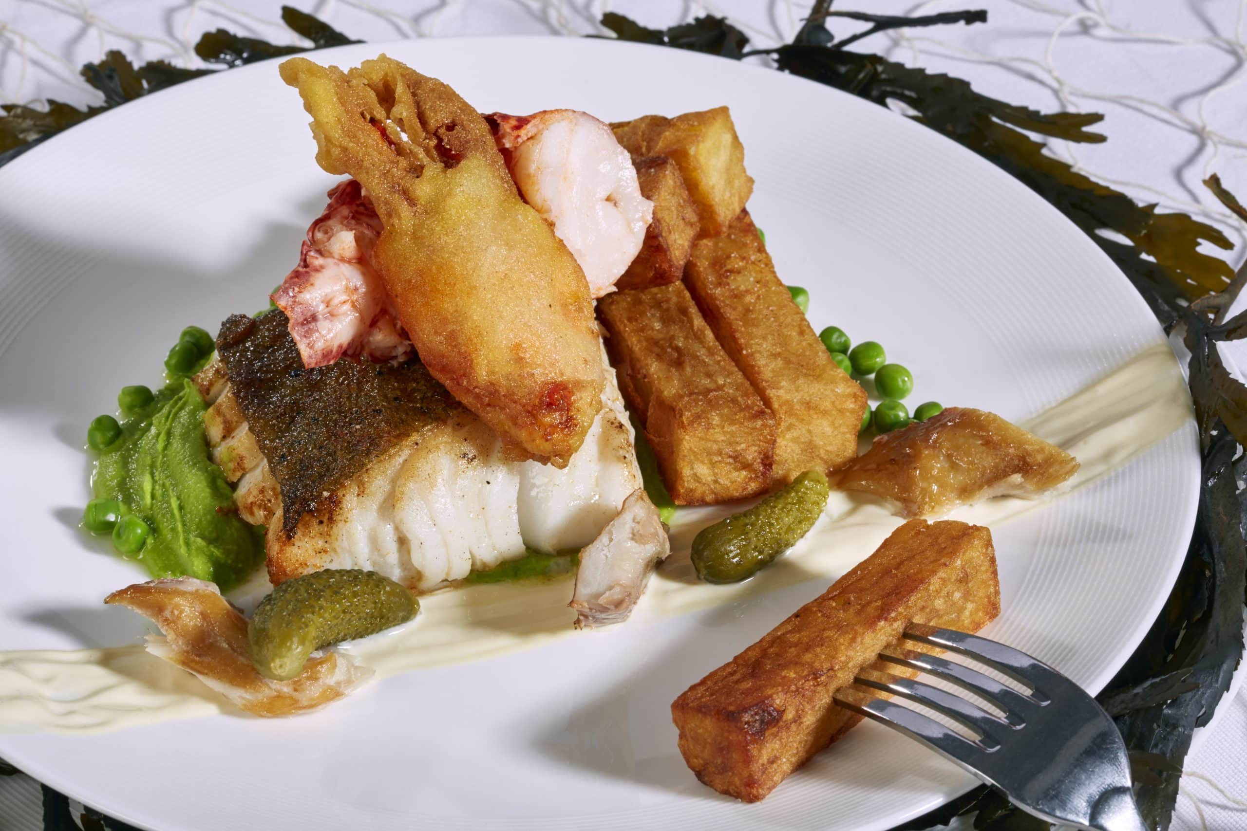 Lobster and chips, fillet of cod, peas and smoked mackerel aioli Lobster and chips, fillet of cod, peas and smoked mackerel aioli